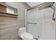 Bright bathroom features wood-look tile, shower, and updated fixtures at 2221 Mohawk St, Las Vegas, NV 89146