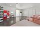 Spacious bedroom area with makeup vanity, closet doors, and luxury oversized seating at 2221 Mohawk St, Las Vegas, NV 89146