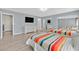Bedroom with two beds, wood floors, large mirror closet doors, and dresser at 2221 Mohawk St, Las Vegas, NV 89146