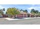 Exterior elevation of home showcasing a well-kept yard and a multi-car garage at 2221 Mohawk St, Las Vegas, NV 89146