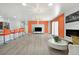 Modern living room with an open-concept design that includes bar seating and a cozy fireplace, ideal for entertaining at 2221 Mohawk St, Las Vegas, NV 89146