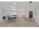 Open-concept space features stylish wood flooring, dining table, and a warm, inviting atmosphere at 2221 Mohawk St, Las Vegas, NV 89146
