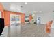 Spacious living room with modern fireplace, stylish decor, and sliding glass door leading to the outdoors at 2221 Mohawk St, Las Vegas, NV 89146