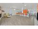 Open-concept living room and kitchen with modern bar stools and ample counter space for entertaining guests at 2221 Mohawk St, Las Vegas, NV 89146