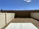 A simple backyard features gravel landscaping and a concrete patio, perfect for outdoor relaxation and entertaining at 2775 Atomic Tangerine Way # 4, Las Vegas, NV 89183