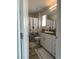 Bathroom featuring white vanity, modern fixtures, decorative shower curtain and tile floors at 2775 Atomic Tangerine Way # 4, Las Vegas, NV 89183