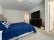 Spacious bedroom featuring neutral carpet, light walls, and a comfortable king-size bed at 2775 Atomic Tangerine Way # 4, Las Vegas, NV 89183