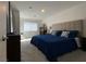 Spacious bedroom featuring neutral carpet, light walls, and a comfortable king-size bed at 2775 Atomic Tangerine Way # 4, Las Vegas, NV 89183