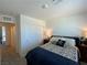 This bedroom features a patterned comforter, closet with sliding doors and neutral paint at 2775 Atomic Tangerine Way # 4, Las Vegas, NV 89183