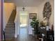 Spacious entryway showcases hardwood floors, a staircase, and a stylish console table at 2775 Atomic Tangerine Way # 4, Las Vegas, NV 89183