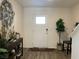 Bright foyer featuring a stylish decor, hard surface floors, and a front door with glass window at 2775 Atomic Tangerine Way # 4, Las Vegas, NV 89183