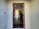 Inviting entryway featuring hardwood floors, a staircase, and views into the home at 2775 Atomic Tangerine Way # 4, Las Vegas, NV 89183