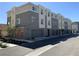 Contemporary townhomes showcasing modern design, private garages, and landscaped surroundings at 2775 Atomic Tangerine Way # 4, Las Vegas, NV 89183