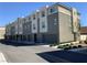 Exterior view of contemporary townhomes featuring a clean design and individual garages for each unit at 2775 Atomic Tangerine Way # 4, Las Vegas, NV 89183