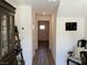 Neutral hallway featuring hardwood floors, white walls, and decor at 2775 Atomic Tangerine Way # 4, Las Vegas, NV 89183
