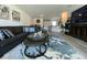 Inviting living room features a comfortable gray sofa and stylish round nesting tables at 2775 Atomic Tangerine Way # 4, Las Vegas, NV 89183