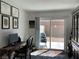 Bright home office with a desk, decor, and sliding glass doors to a private patio at 2775 Atomic Tangerine Way # 4, Las Vegas, NV 89183