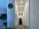 A downward view of a carpeted staircase with white walls, offering a clean and modern design at 2775 Atomic Tangerine Way # 4, Las Vegas, NV 89183