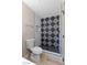Contemporary bathroom showcasing a tiled walk-in shower with bold black and white geometric patterned tile at 3916 S Torrey Pines Dr, Las Vegas, NV 89103
