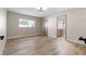 Bedroom featuring neutral walls, wood-look flooring, and a doorway to an attached bathroom at 3916 S Torrey Pines Dr, Las Vegas, NV 89103
