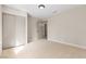 Bright bedroom features neutral carpet, modern lighting, and large closet for ample storage at 3916 S Torrey Pines Dr, Las Vegas, NV 89103