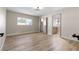 This light-filled bedroom features wood-look flooring and an ensuite bathroom for added convenience at 3916 S Torrey Pines Dr, Las Vegas, NV 89103
