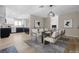 Elegant dining area features modern lighting, stylish decor, and convenient kitchen access at 3916 S Torrey Pines Dr, Las Vegas, NV 89103