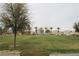 Scenic community view of a lush park with trees, playground, and residential homes at 3936 Pepper Thorn Ave # 102, North Las Vegas, NV 89081