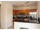 Well-equipped kitchen with stainless steel appliances and wooden cabinets, ample lighting at 3936 Pepper Thorn Ave # 102, North Las Vegas, NV 89081