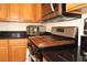 Close-up of the updated kitchen with stainless steel appliances and black countertops at 3936 Pepper Thorn Ave # 102, North Las Vegas, NV 89081