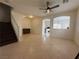 Bright, open living area with tile flooring, staircase, and decorative archways at 3936 Pepper Thorn Ave # 102, North Las Vegas, NV 89081