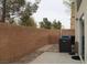 Back patio featuring brick pavers, exterior wall, and a side entrance at 3936 Pepper Thorn Ave # 102, North Las Vegas, NV 89081
