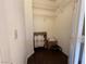 A simple walk-in closet includes some shelving and boxes and space for storage at 3936 Pepper Thorn Ave # 102, North Las Vegas, NV 89081