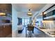 Modern kitchen with stainless steel appliances and an island looking into the living area at 4381 W Flamingo Rd # 1510, Las Vegas, NV 89103