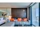 Elegant living room featuring a comfortable sofa with colorful pillows and large windows with city views at 4381 W Flamingo Rd # 1510, Las Vegas, NV 89103