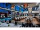 Elegant restaurant offers indoor and outdoor seating and a pool view through large windows at 4381 W Flamingo Rd # 1510, Las Vegas, NV 89103
