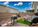 Enclosed backyard featuring a grill and patio dining furniture at 4606 Engage St, North Las Vegas, NV 89031