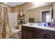 Standard bathroom with a shower-tub combination, a large mirror, and ample vanity space at 4606 Engage St, North Las Vegas, NV 89031