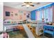 Fun bedroom design with a slide coming off of the bunk bed and colorful accents at 4606 Engage St, North Las Vegas, NV 89031