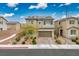 Charming home with a two-car garage, beautiful landscaping, and solar panels on the roof at 4606 Engage St, North Las Vegas, NV 89031