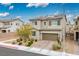 Charming two-story home with a well-maintained yard, driveway, and an attached garage at 4606 Engage St, North Las Vegas, NV 89031