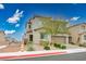 Inviting two-story home with manicured landscaping, a paved driveway, and an attached garage at 4606 Engage St, North Las Vegas, NV 89031