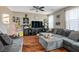 Inviting living room with hardwood floors, cozy seating, and plenty of natural light at 4606 Engage St, North Las Vegas, NV 89031
