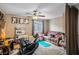 Cozy living room featuring a ceiling fan, comfortable seating, and decor at 4606 Engage St, North Las Vegas, NV 89031