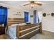 Bedroom featuring wood-frame bed, carpeted floor, and ceiling fan at 4606 Engage St, North Las Vegas, NV 89031
