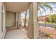 Charming covered front porch with architectural columns and desert landscaping provides curb appeal at 4679 El Camino Cabos Dr, Las Vegas, NV 89147