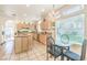 The kitchen features granite countertops, an island and stainless steel appliances at 4679 El Camino Cabos Dr, Las Vegas, NV 89147