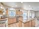 Bright kitchen features granite countertops, a central island and stainless steel appliances at 4679 El Camino Cabos Dr, Las Vegas, NV 89147