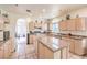 This kitchen has a granite island, stainless steel appliances, and ample cabinet space at 4679 El Camino Cabos Dr, Las Vegas, NV 89147