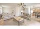 Living room showcasing an open floor plan leading to the kitchen and dining area at 4679 El Camino Cabos Dr, Las Vegas, NV 89147